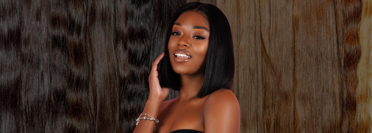Model wearing sleek straight black human hair, with hair bundles in the background